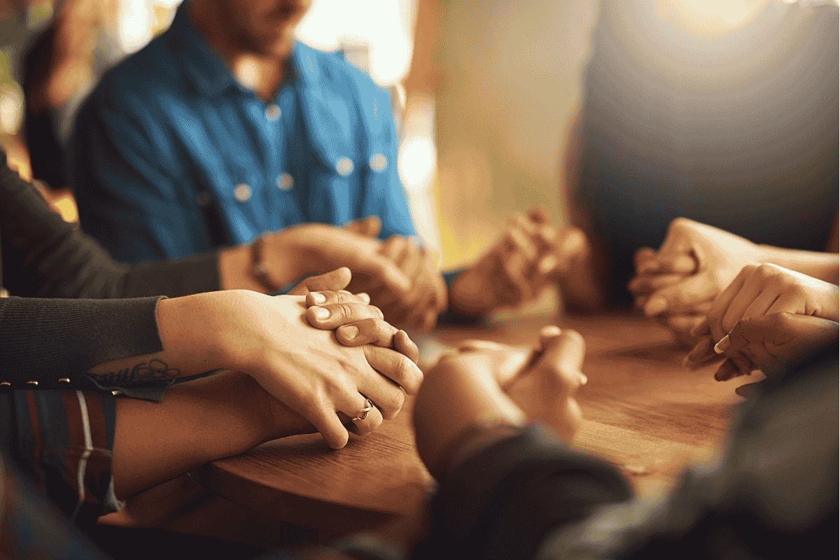 Community group praying together